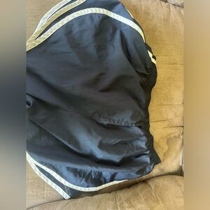 A basic pair of black-and-white Nike shorts, size medium